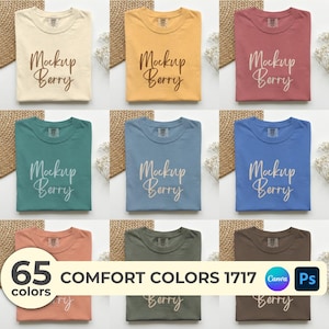 An aesthetic collage mockup for Comfort Colors 1717 t-shirt, showing different views of a white shirt: folded with lavender on wood, worn by a male and a female model, with an oversized fit option. Includes Ps and Canva icons with '36 Colors' badge, labeled 'Video Mockup' and 'Digital Download'