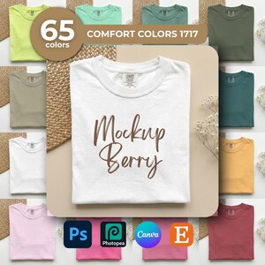 K&ouml;nnte beinhalten: Ein wei&szlig;es T-Shirt mit dem Text "Mockup Berry" in brauner Schrift steht im Mittelpunkt. Das Bild zeigt eine Vielzahl von T-Shirt-Farben, darunter Gr&uuml;n, Rosa und Gelb. Der Text "65 Farben" und "Comfort Colors 1717" sind ebenfalls sichtbar.