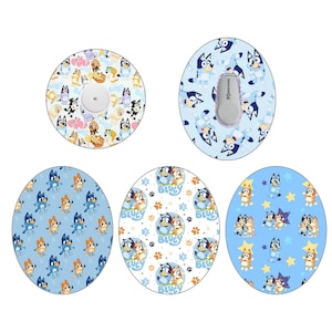 May include: Four different designs of round stickers featuring characters from the animated series Bluey. The stickers are blue, white and yellow with cartoon images of Bluey and Bingo.