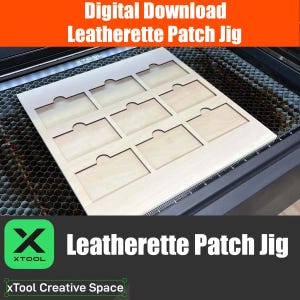 May include: A wooden template for making leatherette patches. The template has eight rectangular cutouts with rounded corners. The template is on a laser cutter bed. The text "Leatherette Patch Jig" is visible in the image.