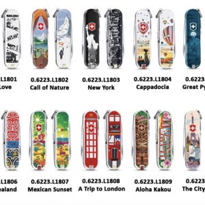 May include: Ten different pocket knives with colourful designs featuring various landmarks and locations around the world. Each knife has a red Swiss Army logo and a silver blade.