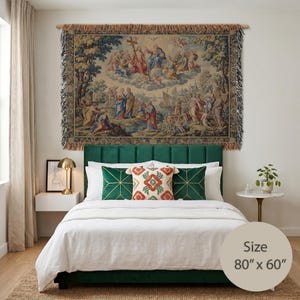 May include: A rectangular woven wall tapestry featuring a detailed religious scene with figures in a landscape and clouds, finished with decorative fringe on the top and bottom edges. The tapestry displays the printed text Size 80" x 60".