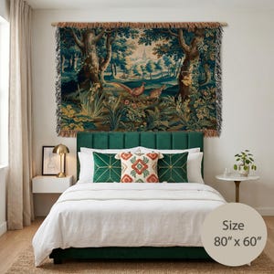 May include: A rectangular woven wall tapestry featuring a forest landscape with two pheasants, trees, and a distant spire. The tapestry has fringed edges and measures 80 inches by 60 inches, displaying deep green, brown, and muted earth tones.