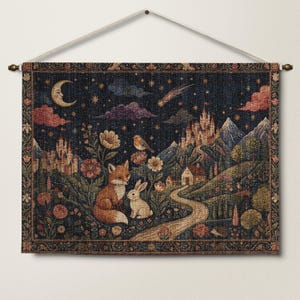 May include: A rectangular woven wall tapestry featuring a dark night sky with a crescent moon, stars, and a shooting star. The scene depicts a fox and a rabbit in a floral meadow, a winding path leading to a small house, and a distant castle.