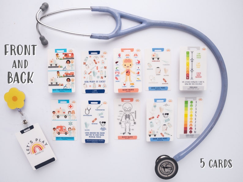 May include: A set of 10 colourful educational flashcards for kids featuring medical themes. The cards have illustrations of medical tools, body parts, and a thermometer with a temperature scale. The cards are designed to help children learn about the human body and medical care. The cards are laid out on a white surface with a stethoscope and a badge holder.