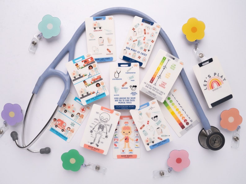 May include: A set of colourful, illustrated flashcards with a stethoscope and flower-shaped badge holders. The flashcards feature medical-themed images and text, including "How Many of Each?", "Body Parts", and "Spot the Difference".