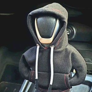 Funda divertida para la palanca de cambios del coche. Mini sudadera con capucha para el pomo del cambio de marchas.