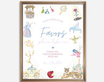 May include: A framed print with a gold border featuring watercolor illustrations of fairytale elements. The text reads "Such a Magical Day, Favors, please take one, Thank you for celebrating with me! love Charlotte."