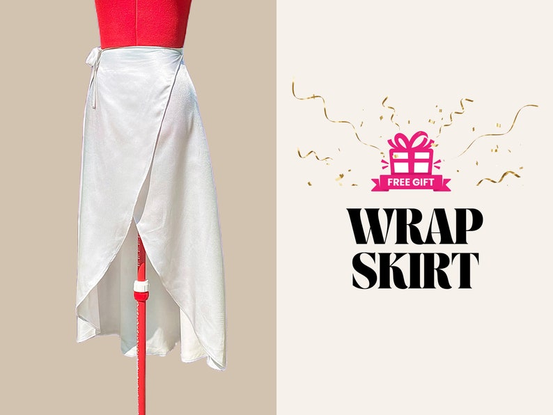 May include: A white wrap skirt made of a silky fabric. The skirt is displayed on a red mannequin and tied at the waist. The text "WRAP SKIRT" is displayed in bold, black letters.