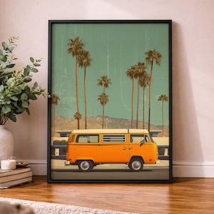 May include: Framed art print featuring an orange vintage van driving on a road with palm trees and mountains in the background. The sky is a teal color. The print is in a black frame.