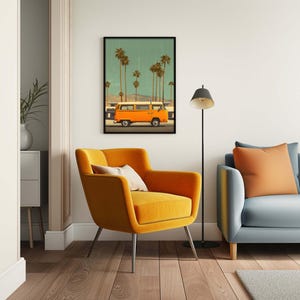 May include: A framed art print depicts an orange van driving past palm trees under a teal sky. The artwork hangs above a mustard yellow armchair with a cream-colored pillow. A gray sofa with orange pillows and a black floor lamp complete the room.