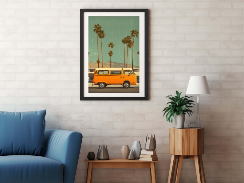 May include: Framed art print featuring an orange vintage van driving past palm trees under a teal sky. The artwork has a retro aesthetic, with a black frame and a white brick wall background. The scene evokes a sense of travel and nostalgia.