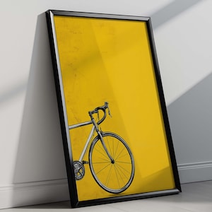 May include: Framed art print with a bicycle illustration. The artwork depicts a detailed black and white bicycle design on a bright yellow background. The frame is black, and the print is leaning against a white wall.