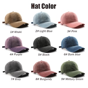 May include: Nine baseball caps in a range of colours: khaki, light blue, pink, purple, black, dark blue, grey, burgundy, and military green. Each cap features a curved peak and an adjustable strap.