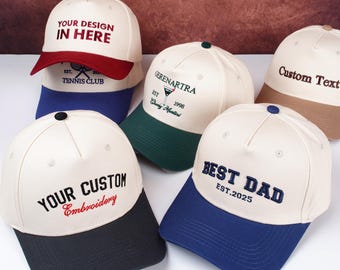 May include: A collection of baseball caps in various colors, including white, navy, red, green, and tan. Each cap features custom embroidery with phrases like "YOUR DESIGN IN HERE," "BEST DAD," and "YOUR CUSTOM Embroidery."