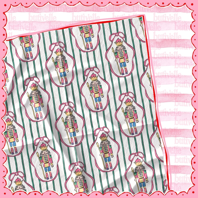 May include: A white and green striped fabric with a repeating pattern of nutcracker figures in pink frames. The nutcrackers are dressed in colorful uniforms and hold staffs. The fabric has the word "butivelle" printed on it.