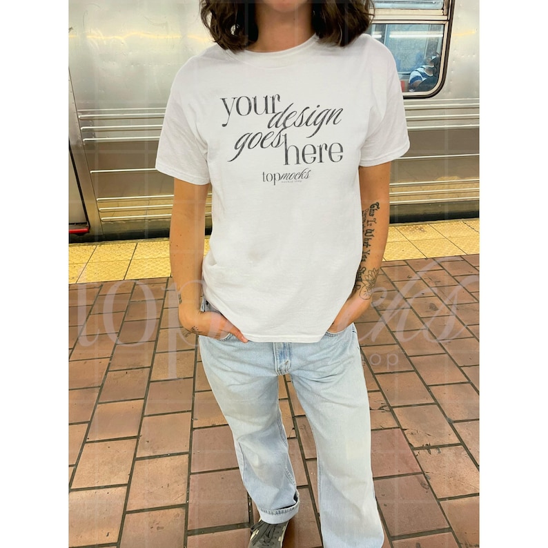 Gildan 5000 white t-shirt city mockup featuring a classic fit perfect for y2k inspired designs this real mockup offers a clean aesthetic ideal for artwork on a white tee creating a stylish look that suits any creative project with a selfie vibe