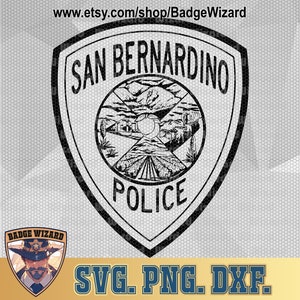 May include: Black and white vector graphic of the San Bernardino Police Department badge. The badge features a shield with the words "San Bernardino Police" and a stylized image of a mountain range and a field of crops.