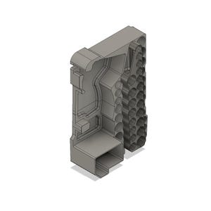 May include: A gray, 3D-rendered model of a rectangular object with a complex internal structure. The design features a series of cylindrical holes on one side and various geometric shapes within its interior. The object has a box-like base and a curved top.