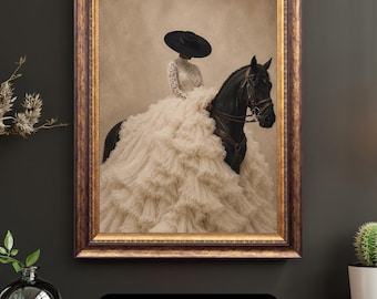 May include: A framed wall art print featuring a person wearing a wide-brimmed black hat and a long, voluminous white lace dress with tiered ruffles, seated on a black horse. The artwork is enclosed in a dark, ornate, textured gold-toned frame.