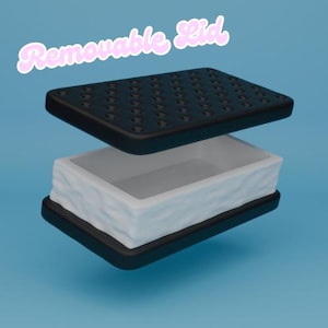 May include: A 3D-rendered ice cream sandwich with a removable lid. The top and bottom layers are black with a grid pattern, while the middle layer is white with a textured, wavy design. The text "Removable Lid" is in pink cursive.