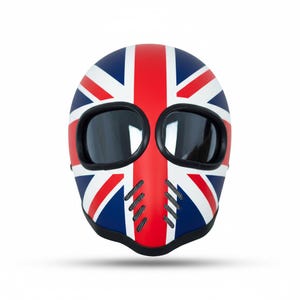 May include: A motorcycle helmet with a Union Jack design. The helmet is red, white, and blue, with a black trim and tinted eye openings. It has ventilation slits on the front.