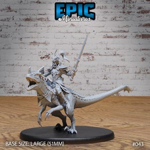 May include: A gray plastic miniature of a warrior riding a dinosaur. The warrior is wearing armor and holding a sword. The dinosaur has a long tail and sharp teeth. The miniature is on a black base. BASE SIZE: LARGE (51MM) #043