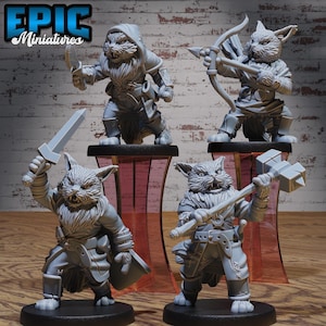 May include: Four grey painted miniature figurines of cats dressed as fantasy characters. The cat on the left is holding a sword, the cat in the middle is holding a hammer, the cat on the right is holding a bow and arrow, and the cat in the back is holding a dagger.