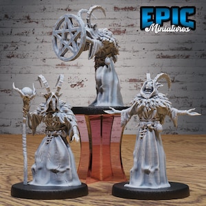 May include: Three gray miniature figures of horned, cloaked characters. One figure holds a staff with a skull-like orb, another holds a wheel with a star, and the third has outstretched arms. The figures are on black bases. The text "EPIC Miniatures" is in the upper right corner.
