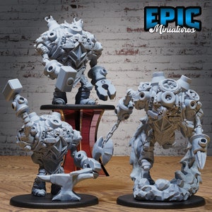 May include: Three gray, detailed, miniature figures of robots with various tools and weapons. The figures are made of plastic and are painted in a gray color. The figures are standing on a gray surface. The figures are from Epic Miniatures.