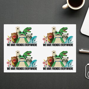 May include: Four white stickers with a colorful cartoon animal design. Each sticker features a group of animals including a frog, bear, raccoon, and shark. The text "WE HAVE FRIENDS EVERYWHERE" is printed in black.