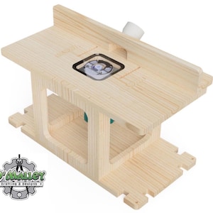 Könnte beinhalten: Ein helles Holzfrästisch mit rechteckiger Oberseite und unterer Basis. Der Tisch hat einen eingebauten Router und einen Zaun. Das Logo "O'Malley Drafting & Designs" befindet sich in der unteren linken Ecke.