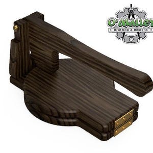 May include: A dark brown wooden tortilla press with a hinged handle and brass accents. The press is closed and ready to flatten tortillas.