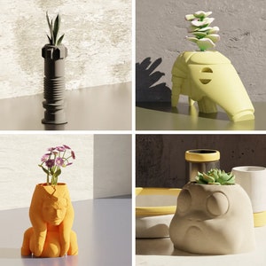 May include: Four different planters with various plants and designs. The planters are made of ceramic and have a variety of colors and shapes. The plants include succulents, flowers, and a small tree.