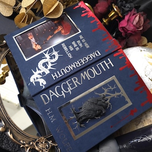 May include: A set of three ceramic mugs with a speckled, matte finish. The mugs are in shades of cream, light gray, and dark gray. Each mug has a simple, minimalist design, perfect for coffee or tea.