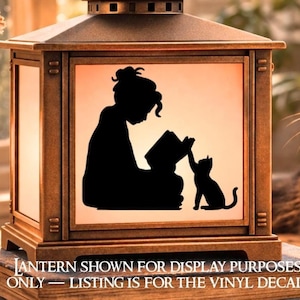 May include: A bronze-colored lantern with a black silhouette of a person reading to a cat. The image is on a white background. The text at the bottom reads: "LANTERN SHOWN FOR DISPLAY PURPOSES ONLY - LISTING IS FOR THE VINYL DECAL."