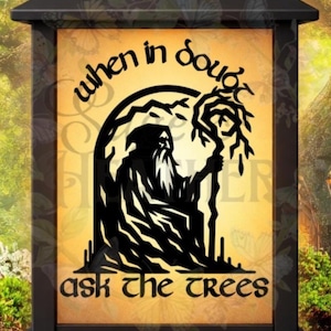 May include: Black outdoor lantern with a yellow background featuring a silhouette of a wizard holding a staff. The text reads "when in doubt ask the trees" in a decorative font. The lantern has a black frame and a peaked roof.