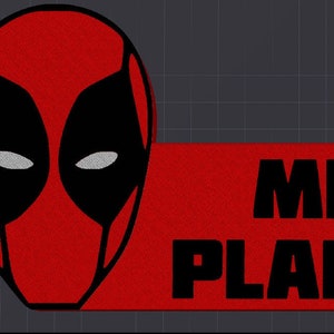 May include: Red and black Deadpool mask with a red banner that says "MR. PLANTE" in black text.