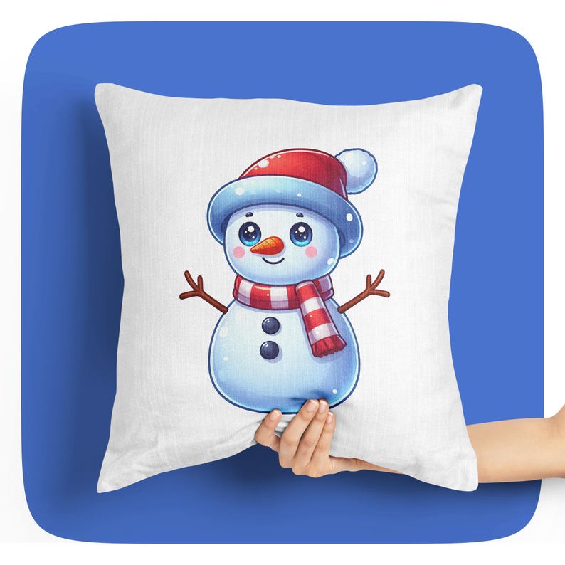 May include: White cushion featuring a cartoon snowman wearing a red and white hat and scarf. The snowman has black eyes, a carrot nose, and two black buttons.