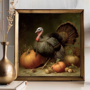 May include: A framed painting of a turkey with pumpkins. The turkey has black feathers, a red wattle, and a blue head. Two large orange pumpkins and several smaller gourds are in the foreground. The frame is gold.