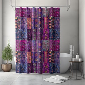 May include: Purple and blue shower curtain with a patchwork design of embroidered floral and geometric patterns.