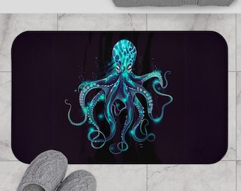 May include: A dark blue bath mat featuring a glowing blue octopus design. The octopus has eight tentacles and is set against a dark blue background.