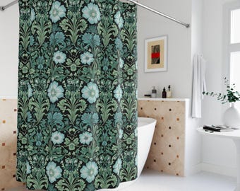 May include: A shower curtain with a floral pattern in shades of green and blue on a black background. The curtain is made of fabric and has a curved bottom edge.