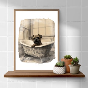 May include: A framed sepia-toned print of a dog in a bathtub. The artwork is in a brown wooden frame. The dog, with brown fur, is in a floral-patterned tub. The print is displayed on a wooden shelf with potted succulents, adding a touch of nature.