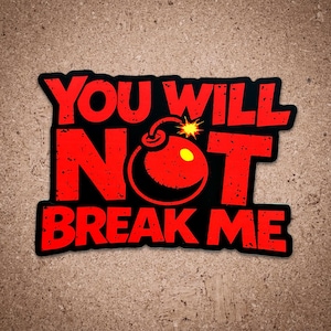 以下が含まれることがあります： 「YOU WILL NOT BREAK ME」の文字が赤色で書かれた黒いステッカー。中央には、黄色い中心と星型の爆弾のグラフィックが描かれています。