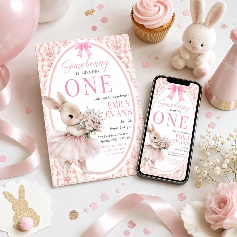 a pink invitation card for a bunny-themed birthday party, along with a smartphone displaying the same invitation, a stuffed bunny toy, and pink and white decorations.