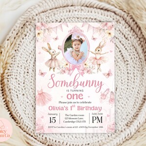 May include: Pink and white birthday invitation with a photo of a child in a pink dress. The invitation says "Somebunny is turning one. Please join us to celebrate Olivia's 1st Birthday. January 15, 3:00-5:00 PM. The Garden room, 125 Blossom Lane, Cambridge CB25 ITB. RSVP to Caroline's mum at 123-45678 by December 28th."