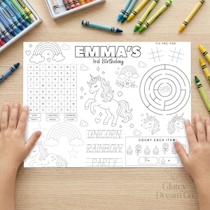 May include: A white activity sheet for a 3rd birthday party featuring black line art of a unicorn, rainbows, a word search, a circular maze, and tracing text that reads EMMA'S 3rd Birthday, UNICORN, RAINBOW, and PARTY, surrounded by colorful crayons.