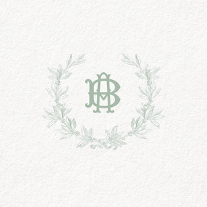 May include: A green monogram with the letters "AB" surrounded by a wreath of leaves.