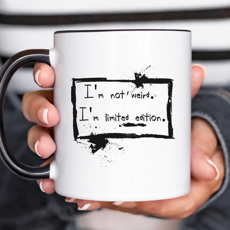May include: White ceramic mug with a black handle. The mug has black ink text that reads "I'm not weird. I'm limited edition."